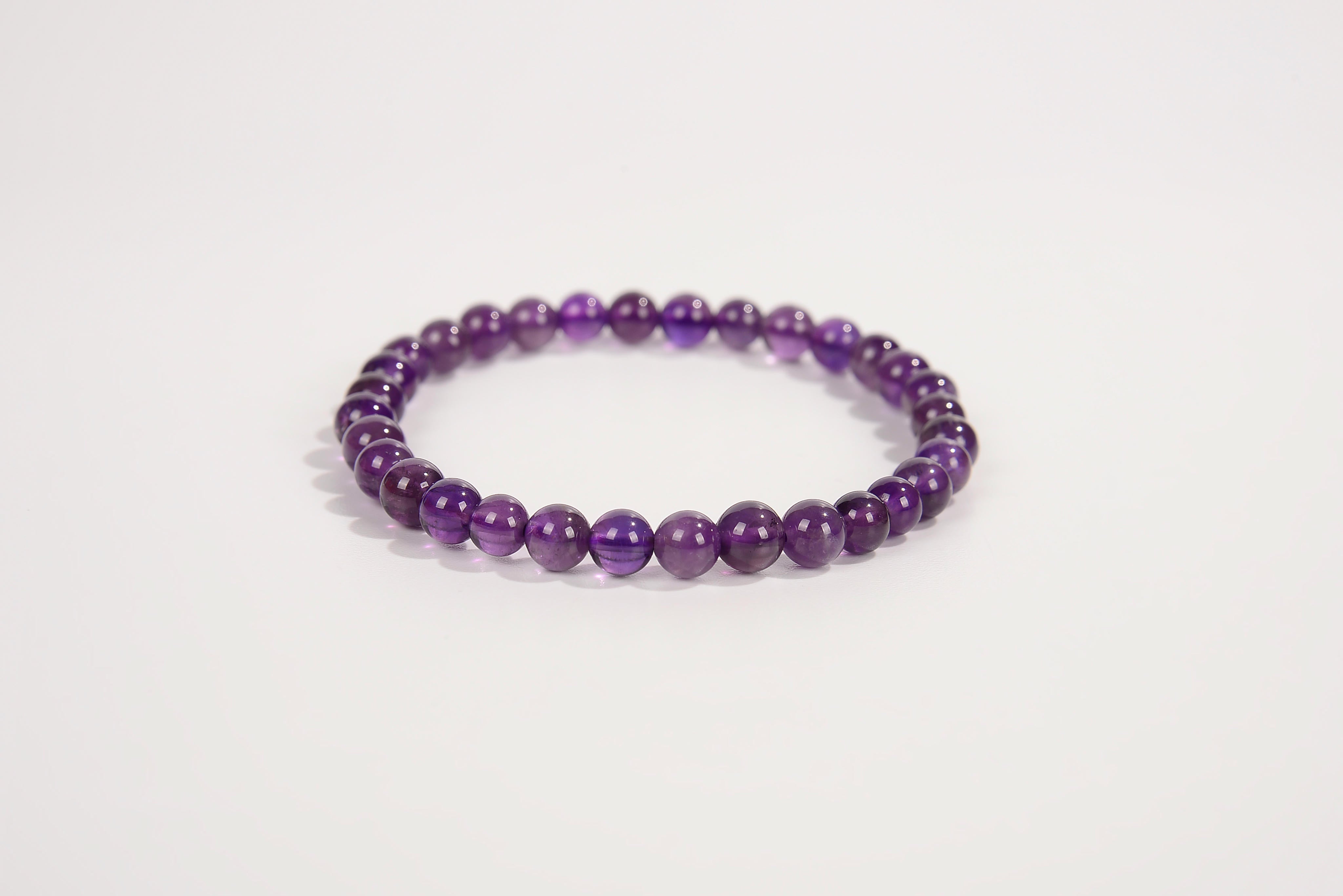 Amethyst beaded bracelet from Raw Earth Crystals, featuring natural gemstones for spiritual growth, intuition, and calming energy.