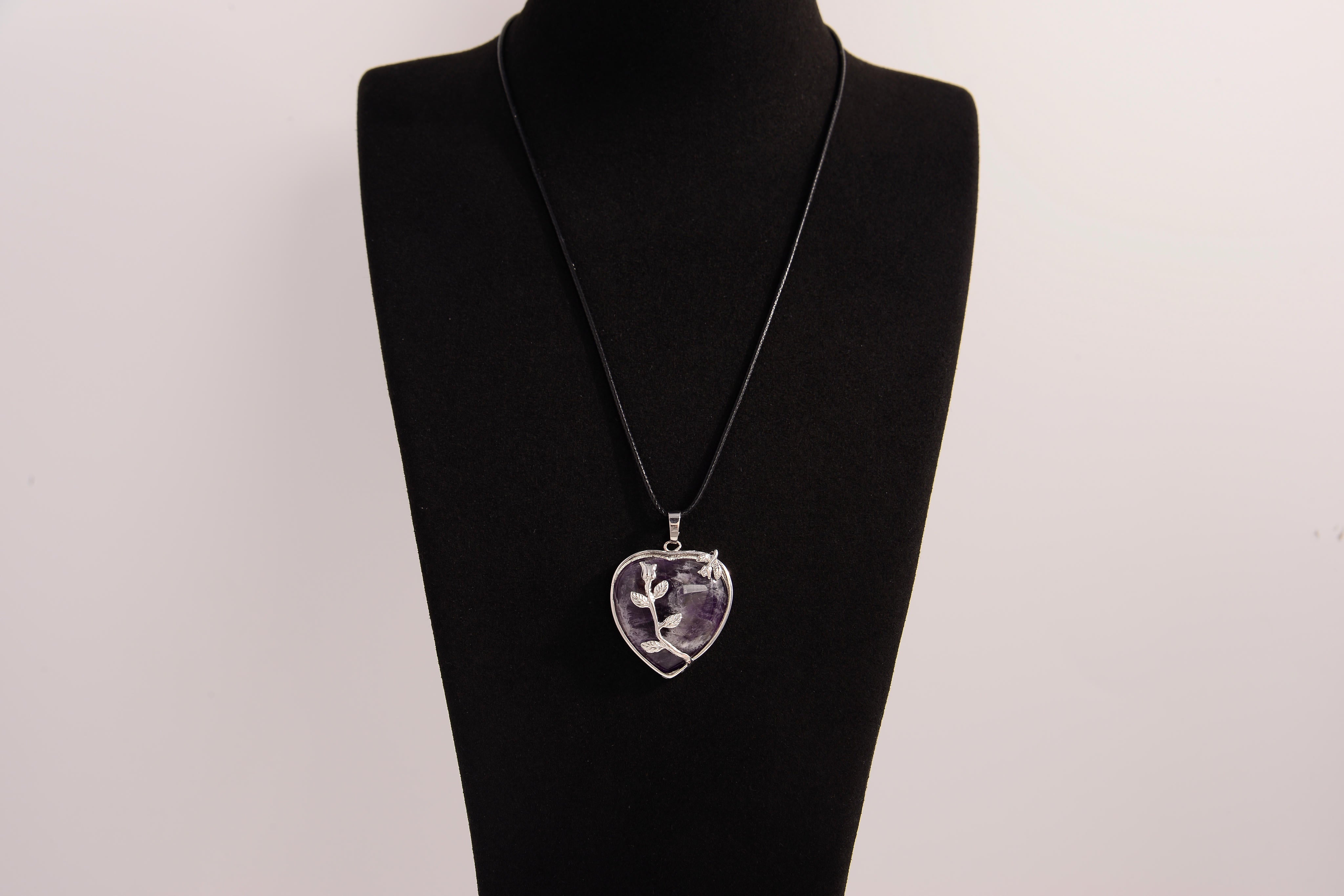 Raw Earth Crystals amethyst heart pendant with an elegant rose design, featuring a deep purple amethyst stone and a silver-tone vine with leaves, promoting spiritual growth, intuition, and inner peace.
