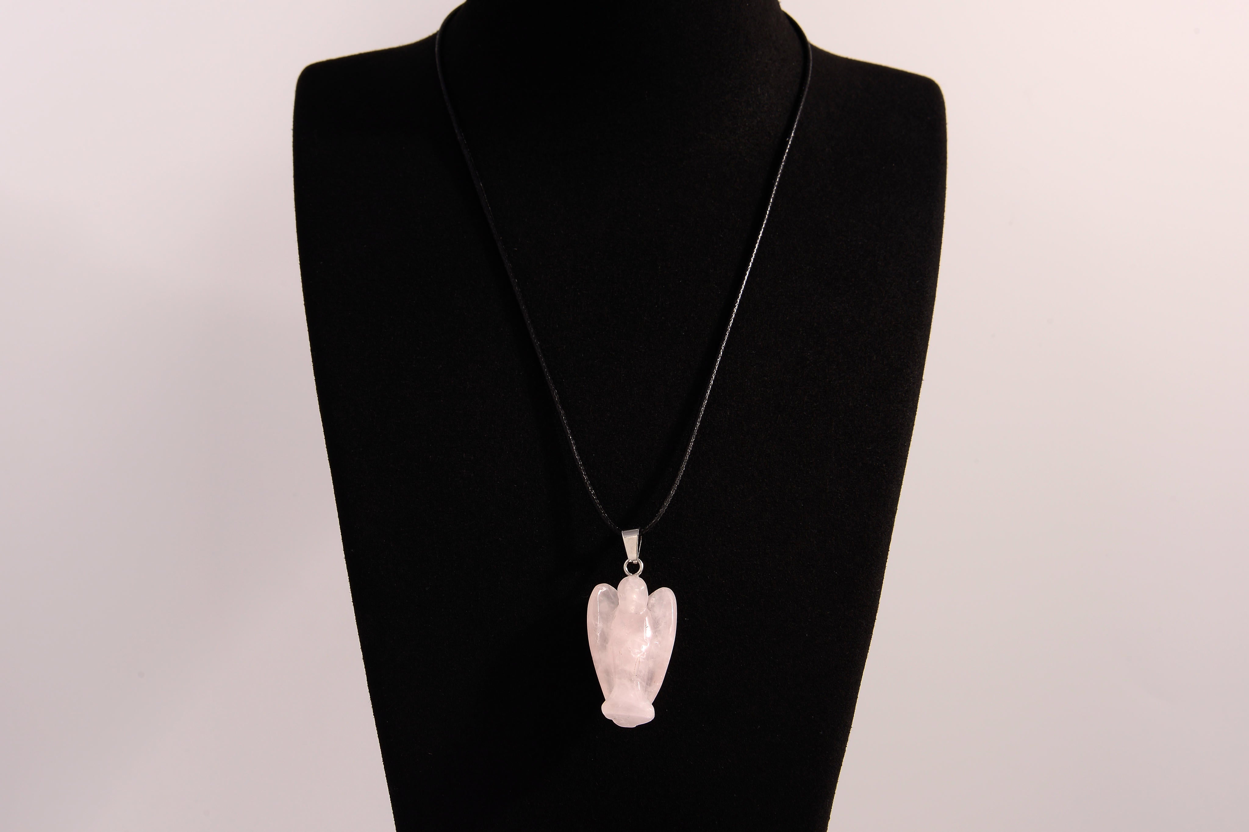 Raw Earth Crystals angel pendant crafted from rose quartz, featuring a delicate sculpted design to promote love, compassion, and emotional healing.