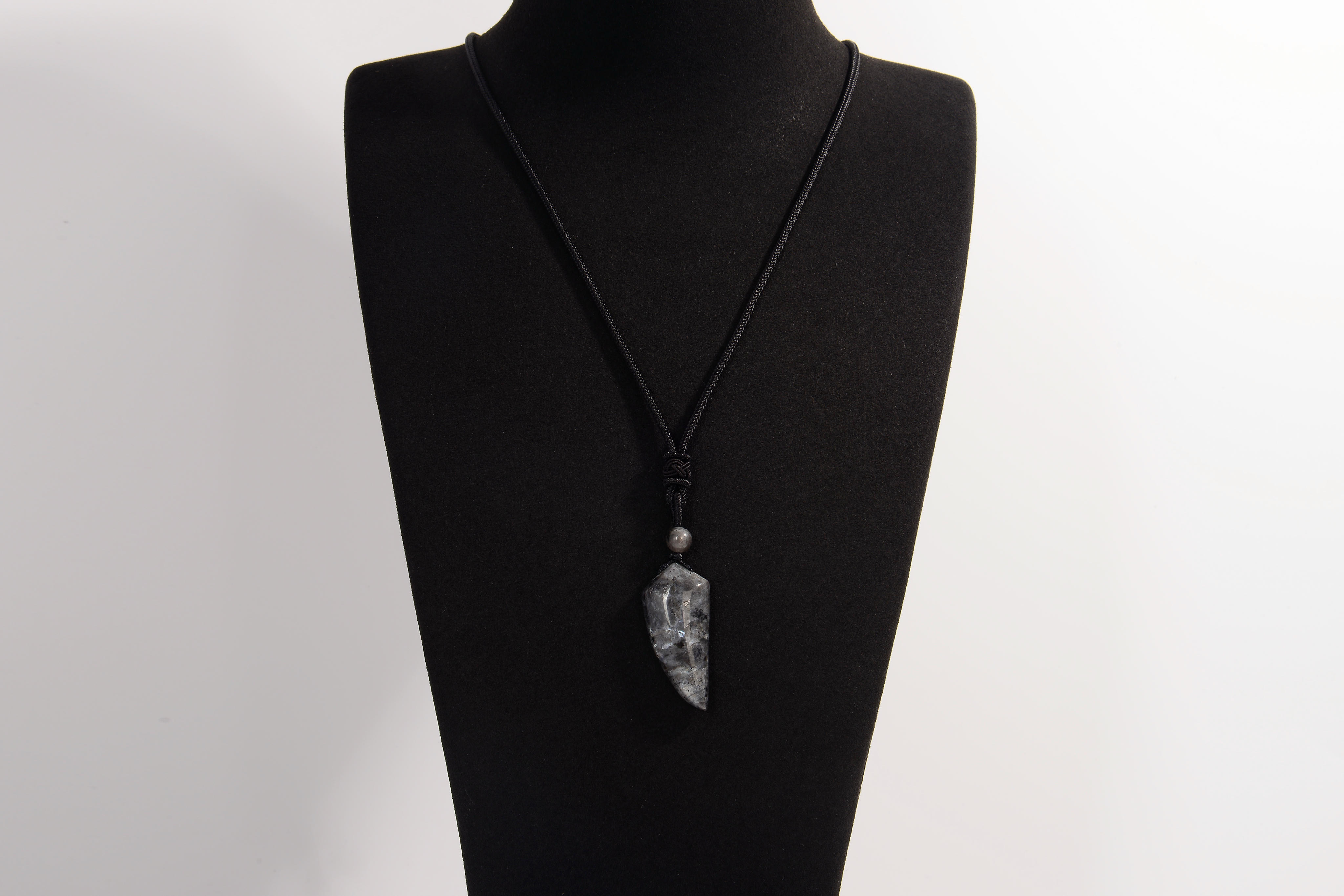 Raw Earth Crystals black labradorite point pendant necklace featuring natural crystal jewelry designed for intuition, spiritual insight, and inner strength.