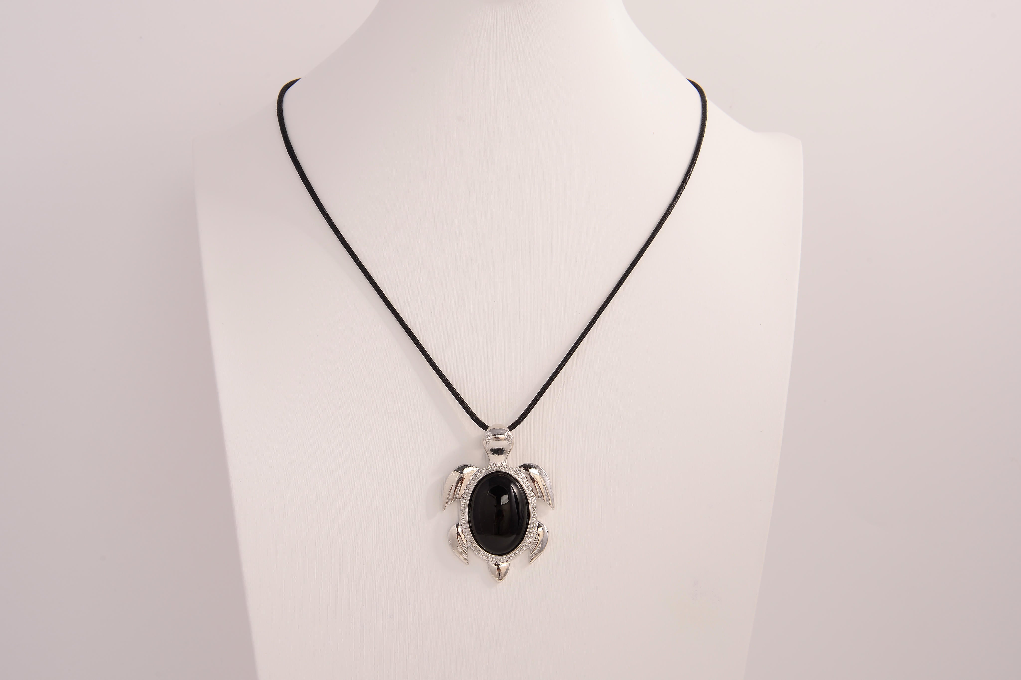 Raw Earth Crystals black obsidian turtle necklace made from natural crystal to offer grounding, protection, and emotional stability.
