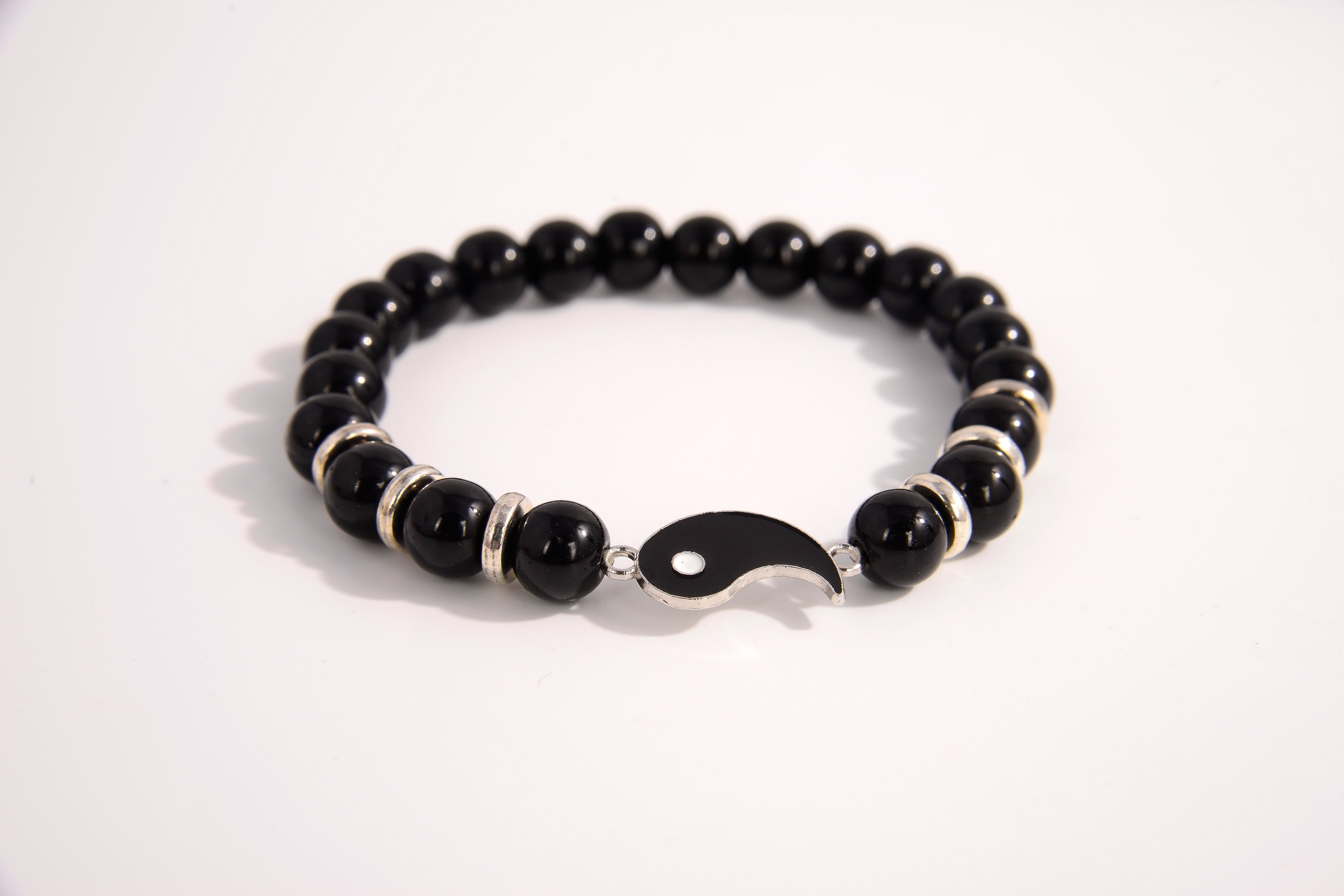 Raw Earth Crystals black tourmaline bracelet with yin yang design, made from natural crystal, supports balance, protection, and spiritual harmony.