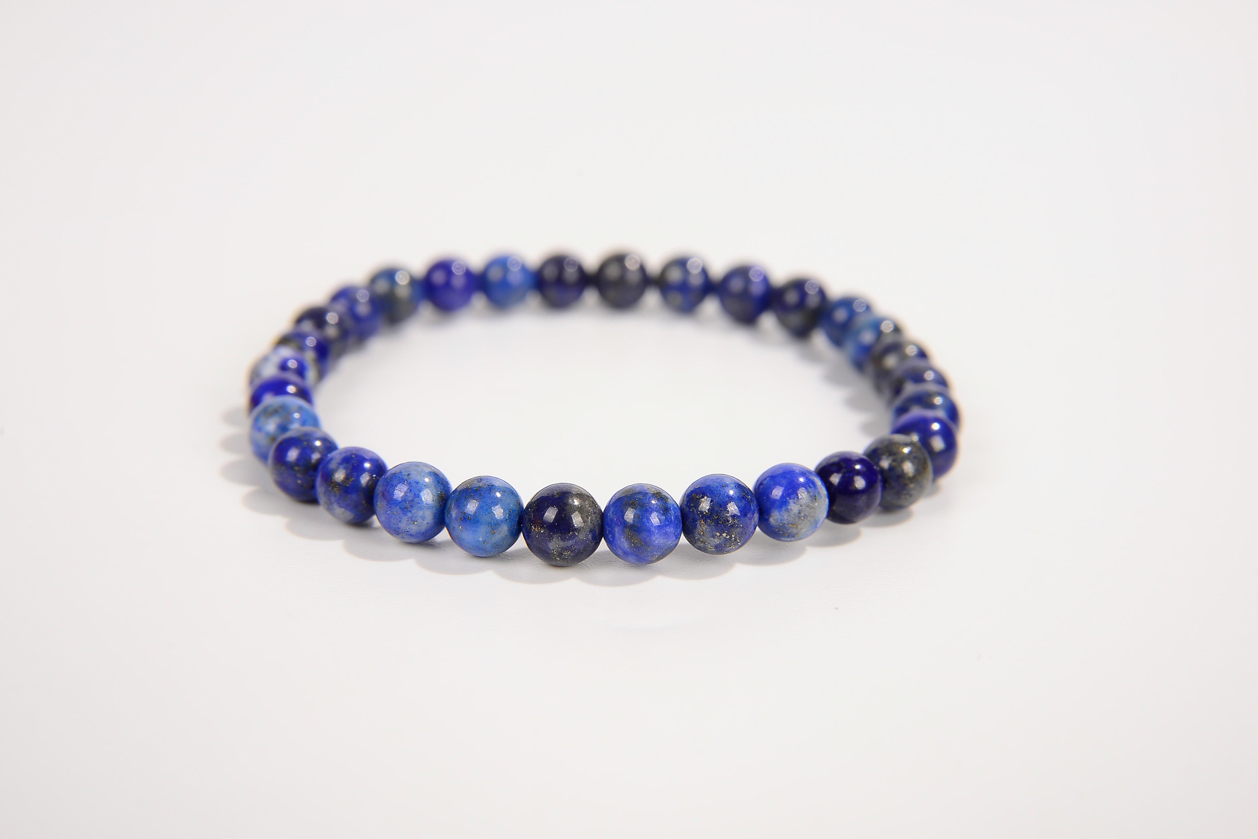 Lapis lazuli beaded bracelet from Raw Earth Crystals, featuring natural gemstones for wisdom, truth, and throat chakra balance.