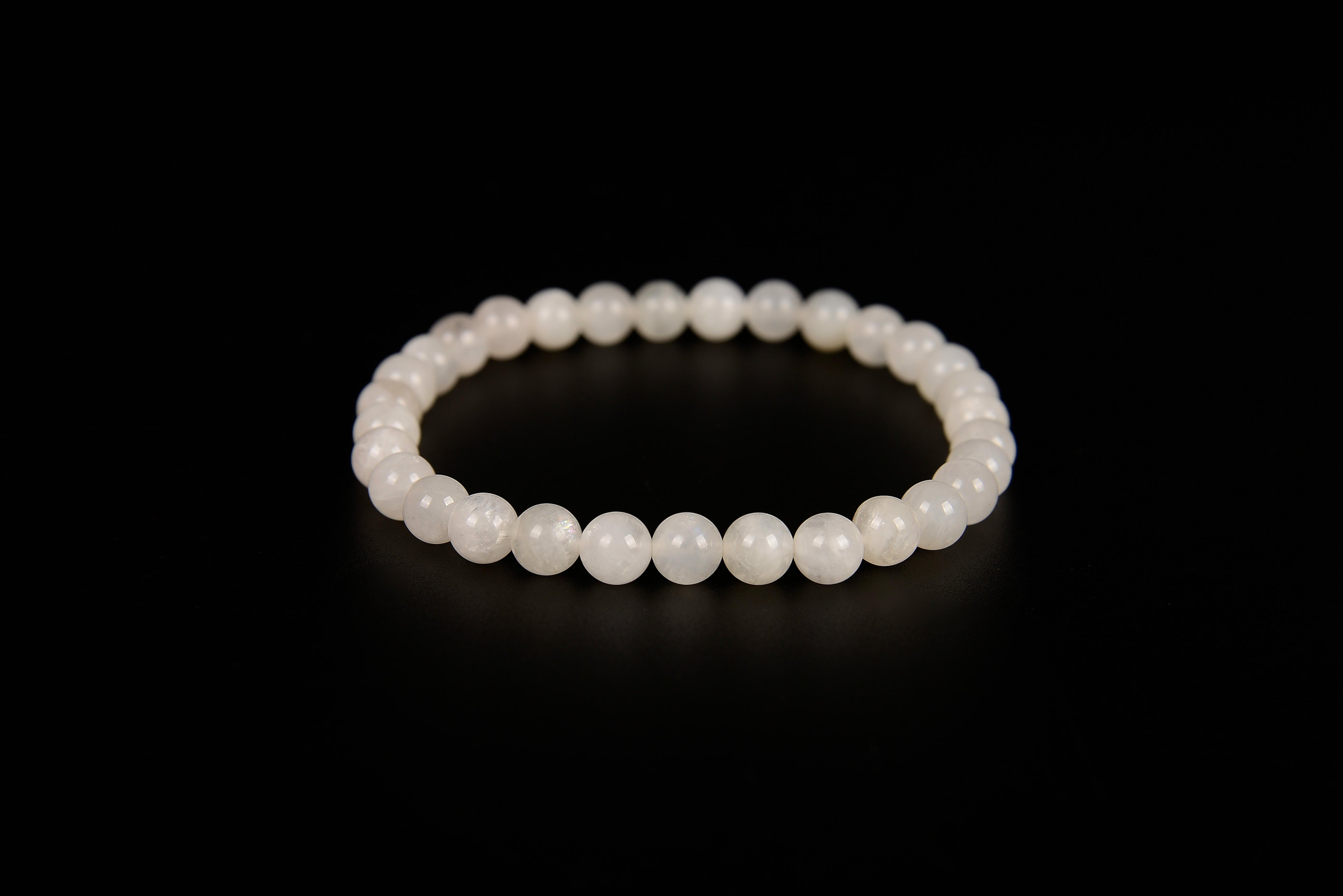 White moonstone beaded bracelet from Raw Earth Crystals, featuring natural gemstones for intuition, emotional balance, and lunar energy.