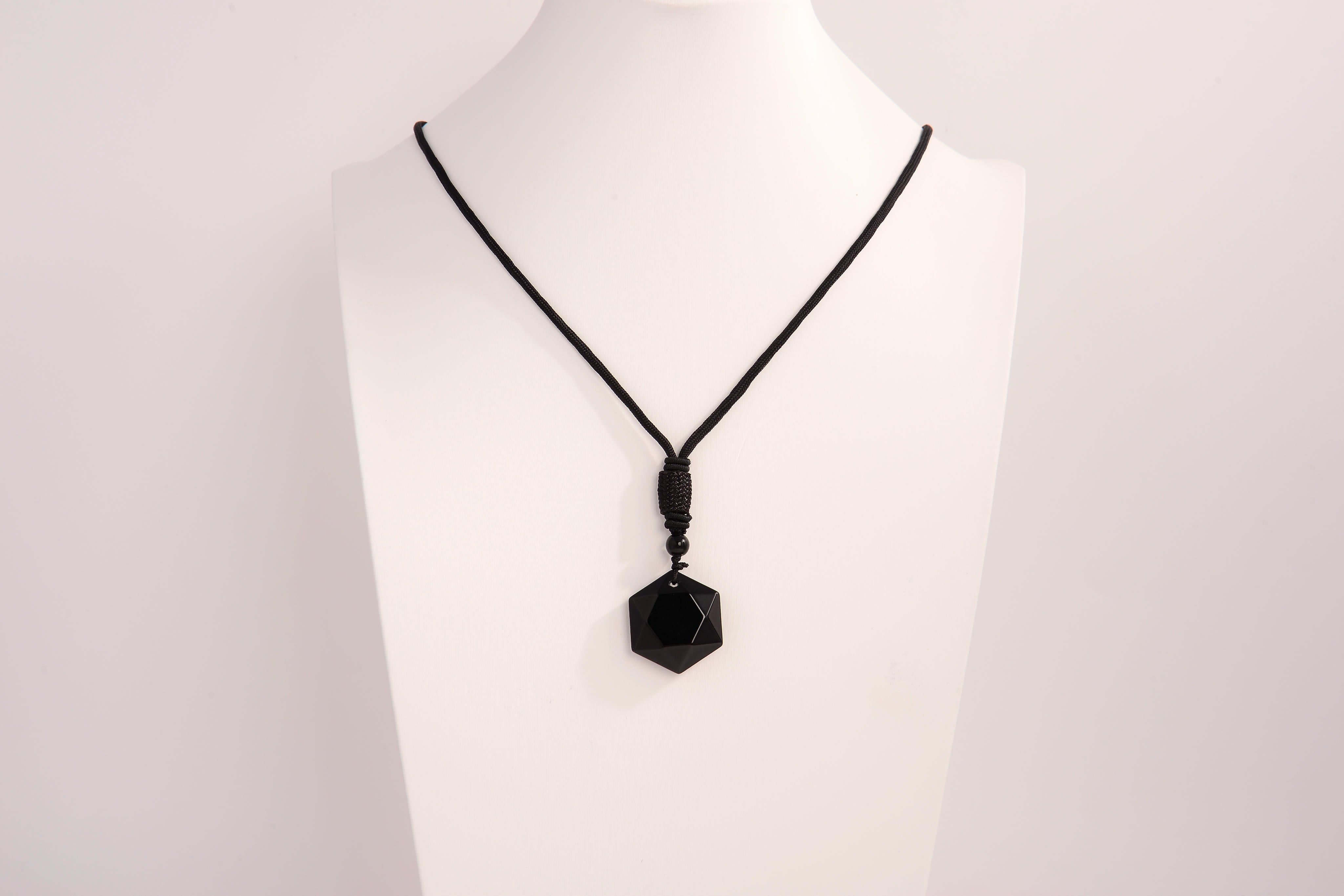 Raw Earth Crystals obsidian geometric pendant necklace crafted from natural crystal for protection, spiritual grounding, and inner clarity.