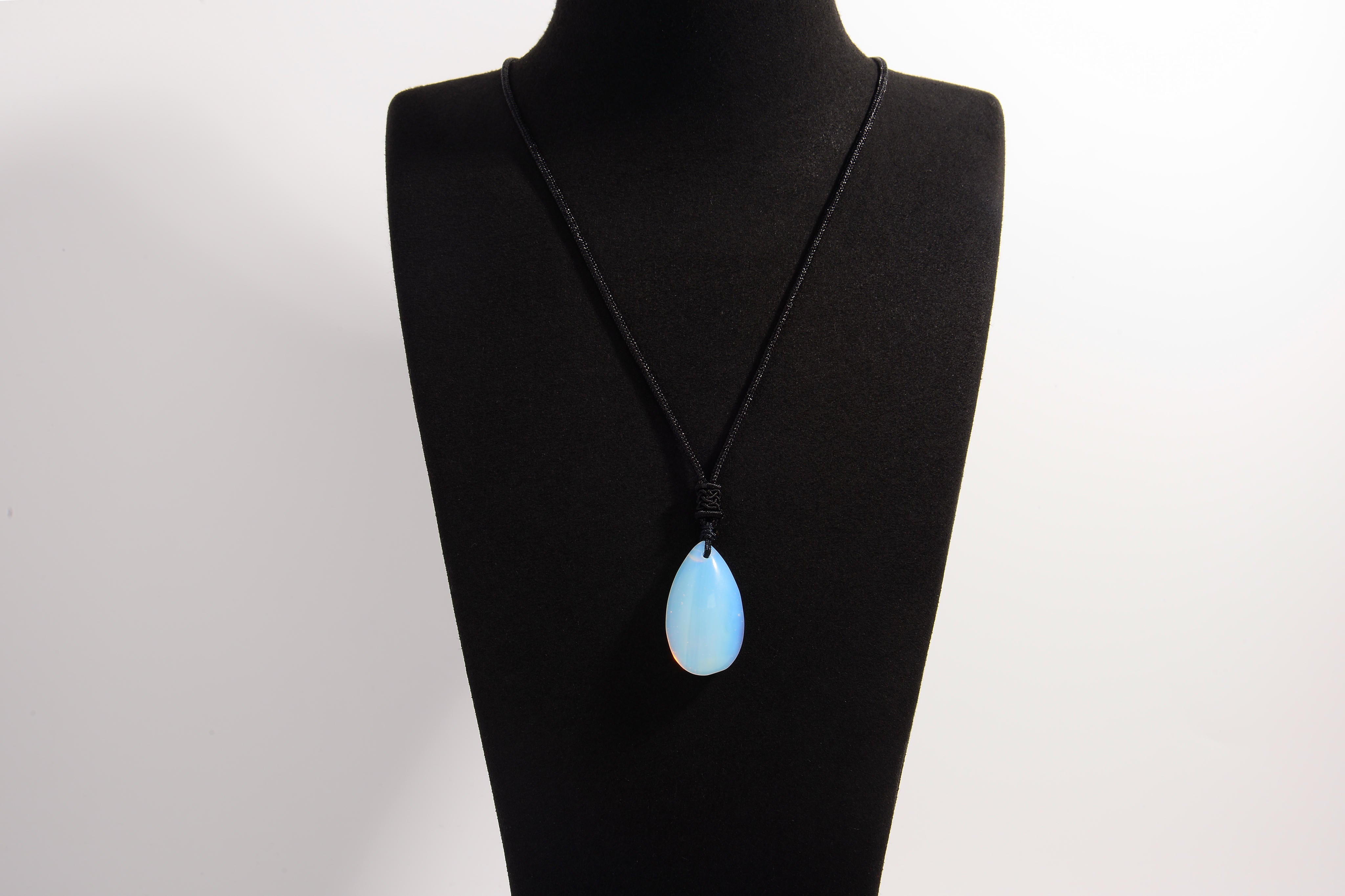 Raw Earth Crystals opal teardrop pendant on black cord, made from natural opal stone, enhancing intuition, emotional healing, and inner clarity.