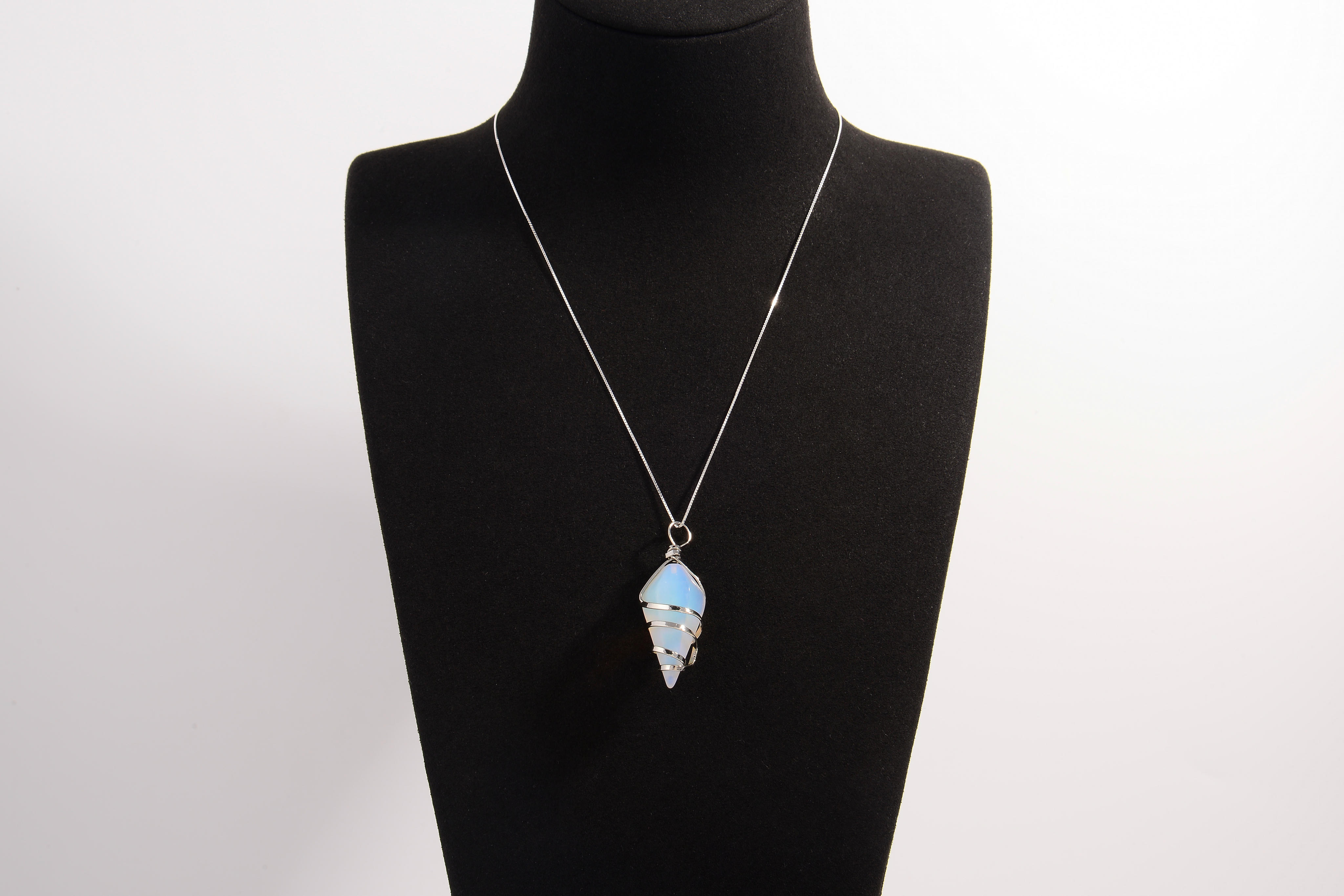 Raw Earth Crystals opalite pendant with a spiral wire wrap design, crafted from natural stone to promote emotional balance, calmness, and inner peace.