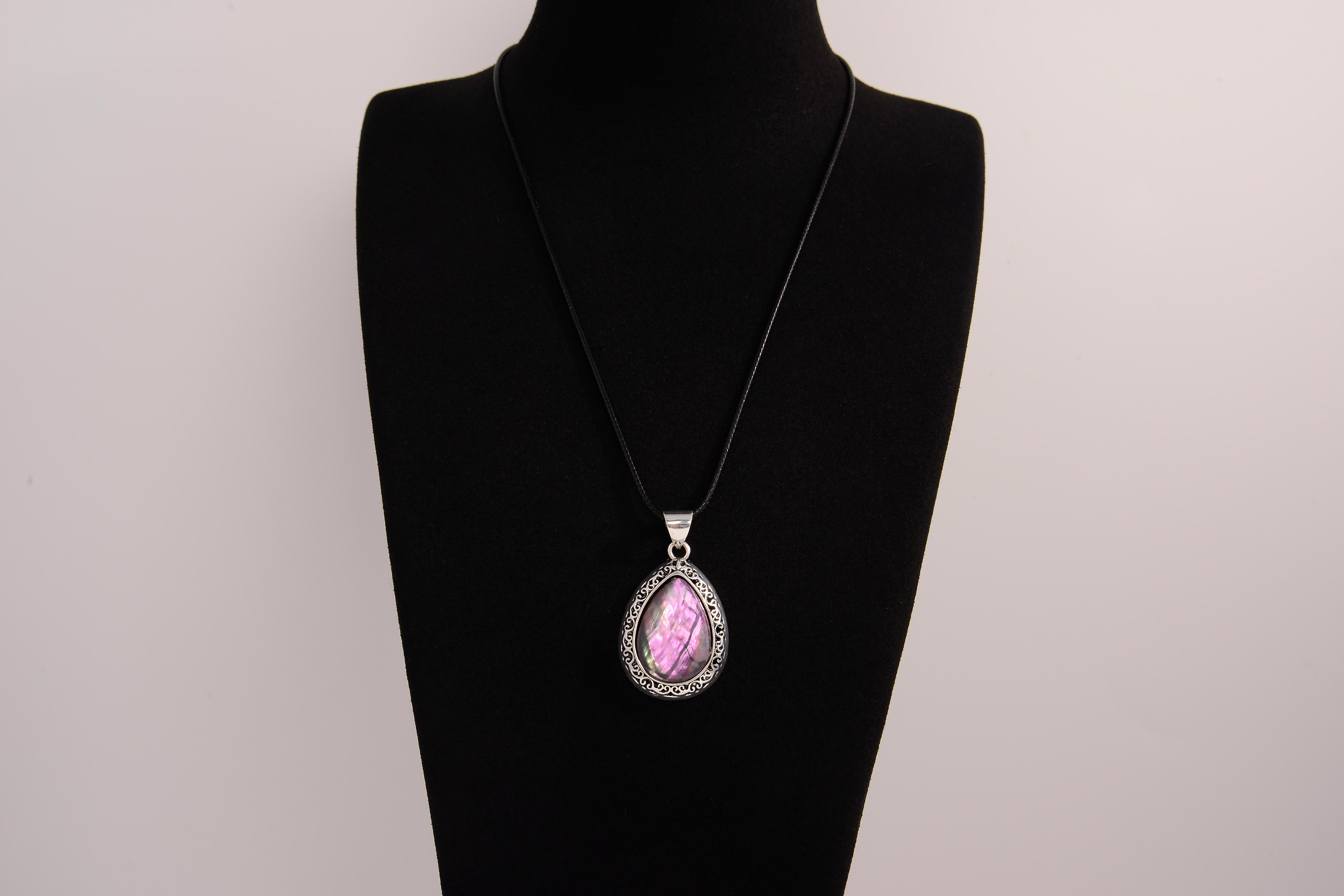 Raw Earth Crystals pink agate pendant with a teardrop-shaped design, featuring natural pink agate and an ornate silver-tone setting, promoting emotional balance, self-love, and gentle energy.