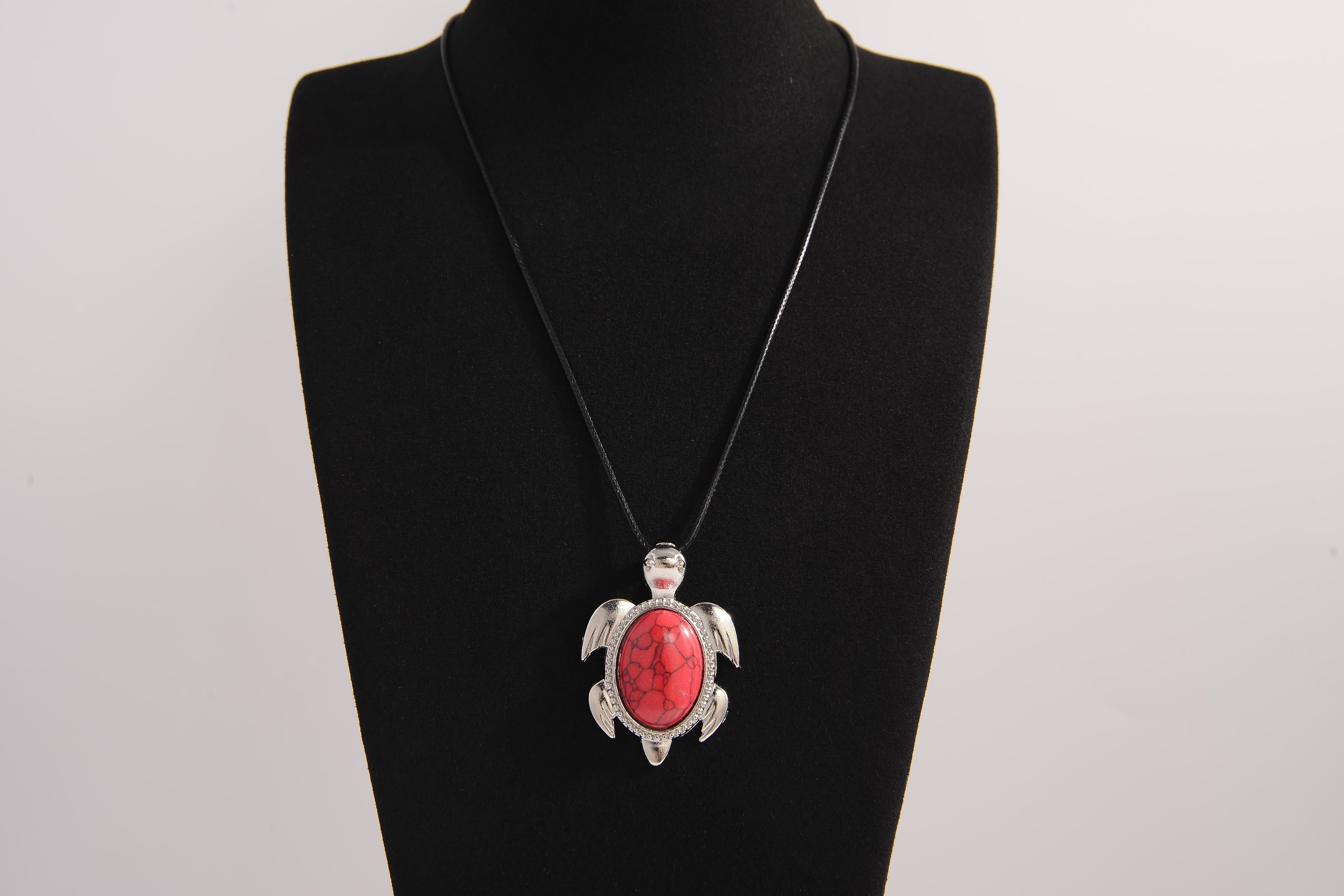 Raw Earth Crystals red howlite turtle necklace crafted from natural stone to support calm focus, stress relief, and emotional grounding.