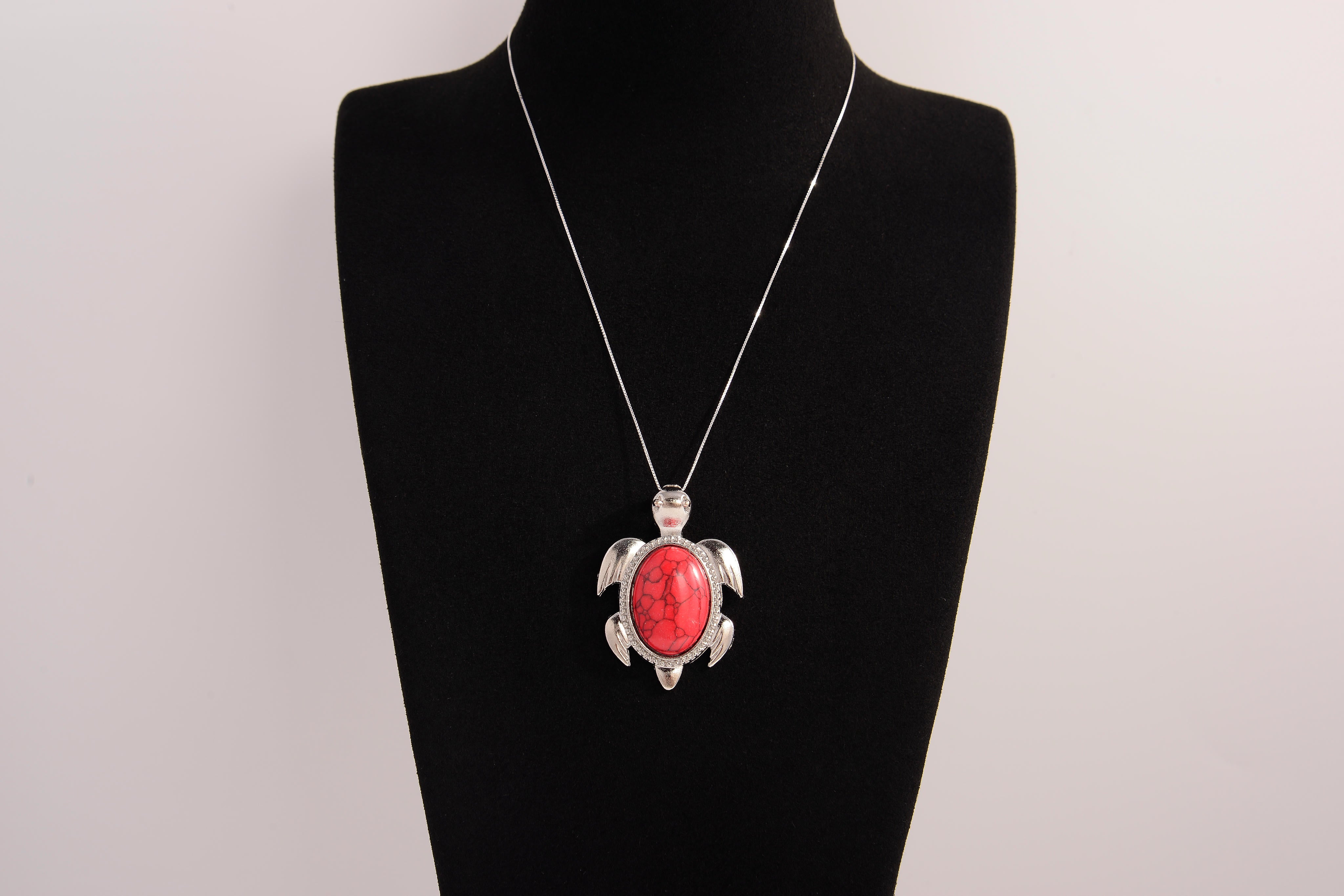 Raw Earth Crystals red howlite turtle necklace crafted from natural stone to support calm focus, stress relief, and emotional grounding.