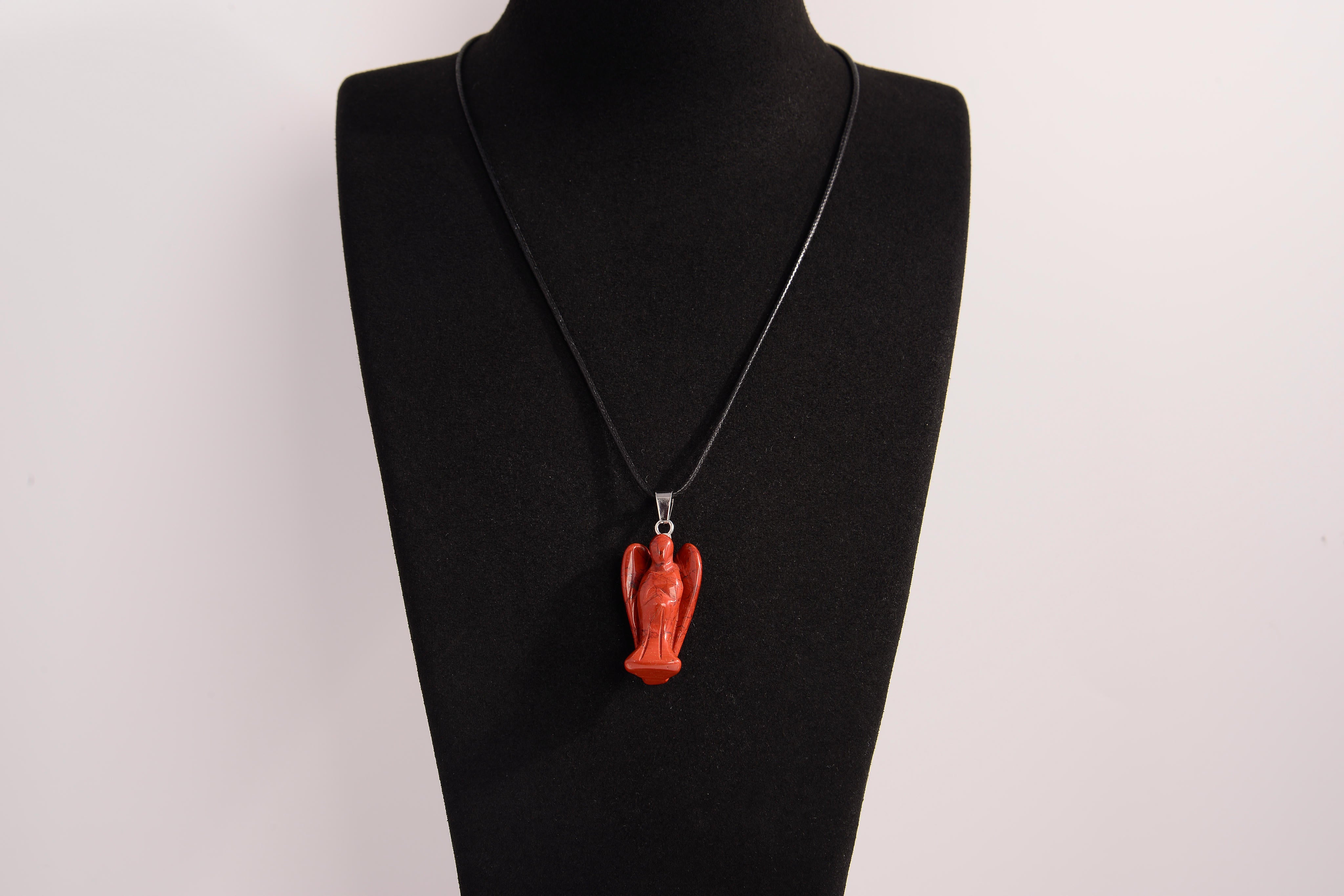Raw Earth Crystals red jasper angel pendant necklace, made from natural red jasper to enhance grounding, stability, and inner strength.