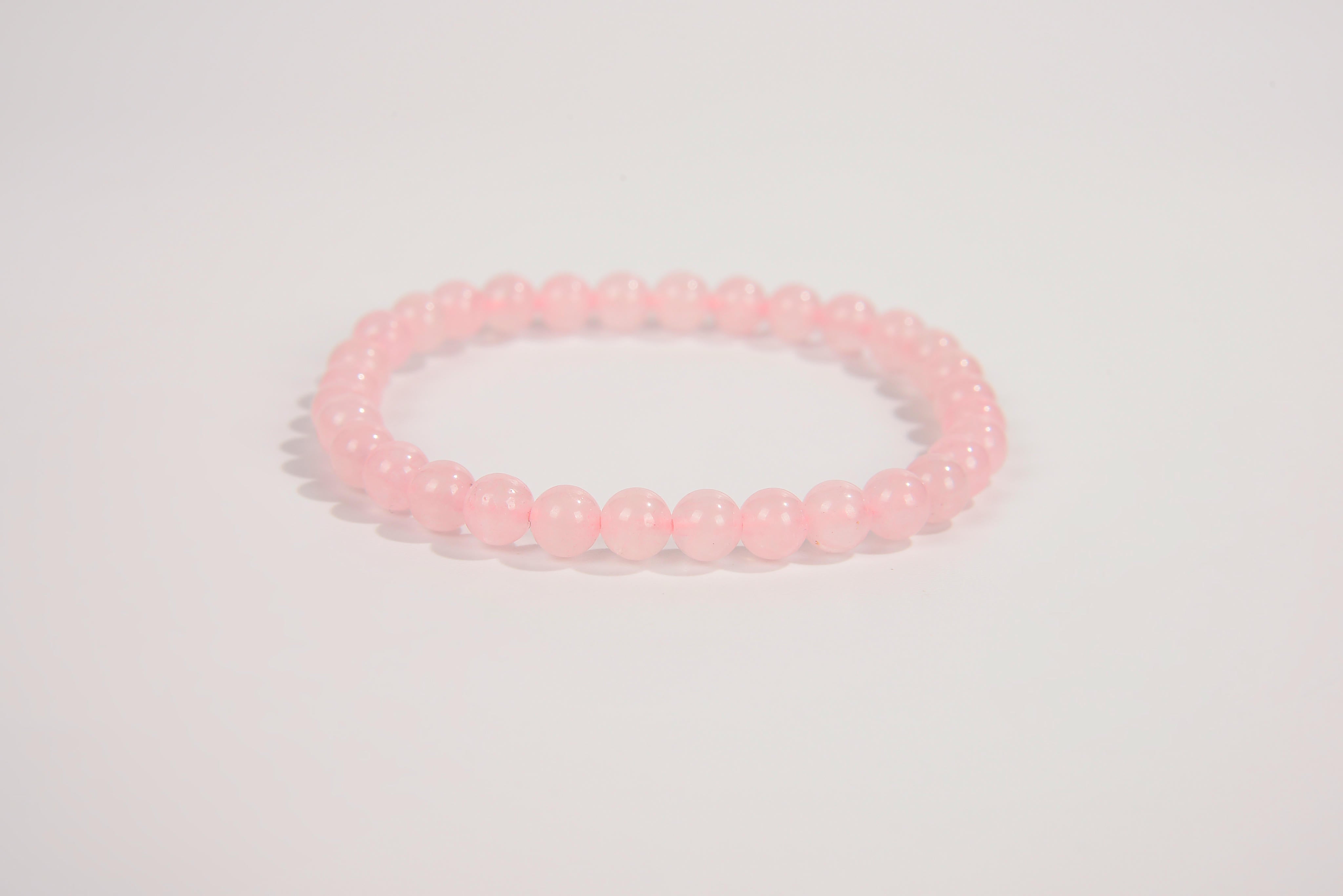 Rose quartz beaded bracelet from Raw Earth Crystals, featuring natural gemstones for love, compassion, and emotional healing.