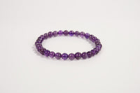 Amethyst beaded bracelet from Raw Earth Crystals, featuring natural gemstones for spiritual growth, intuition, and calming energy.