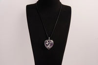 Raw Earth Crystals amethyst heart pendant with an elegant rose design, featuring a deep purple amethyst stone and a silver-tone vine with leaves, promoting spiritual growth, intuition, and inner peace.