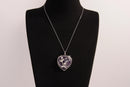 Raw Earth Crystals amethyst heart pendant with an elegant rose design, featuring a deep purple amethyst stone and a silver-tone vine with leaves, promoting spiritual growth, intuition, and inner peace.