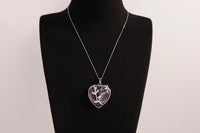 Raw Earth Crystals amethyst heart pendant with an elegant rose design, featuring a deep purple amethyst stone and a silver-tone vine with leaves, promoting spiritual growth, intuition, and inner peace.