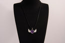 Raw Earth Crystals amethyst heart with wings necklace, featuring a deep purple heart-shaped stone adorned with delicate angelic wings, designed to enhance intuition, promote spiritual growth, and support inner peace.