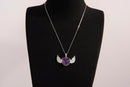 Raw Earth Crystals amethyst heart with wings necklace, featuring a deep purple heart-shaped stone adorned with delicate angelic wings, designed to enhance intuition, promote spiritual growth, and support inner peace.