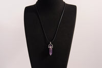 Raw Earth Crystals amethyst necklace with a pointed natural stone pendant, designed to enhance spiritual awareness, promote calmness, and support intuition.