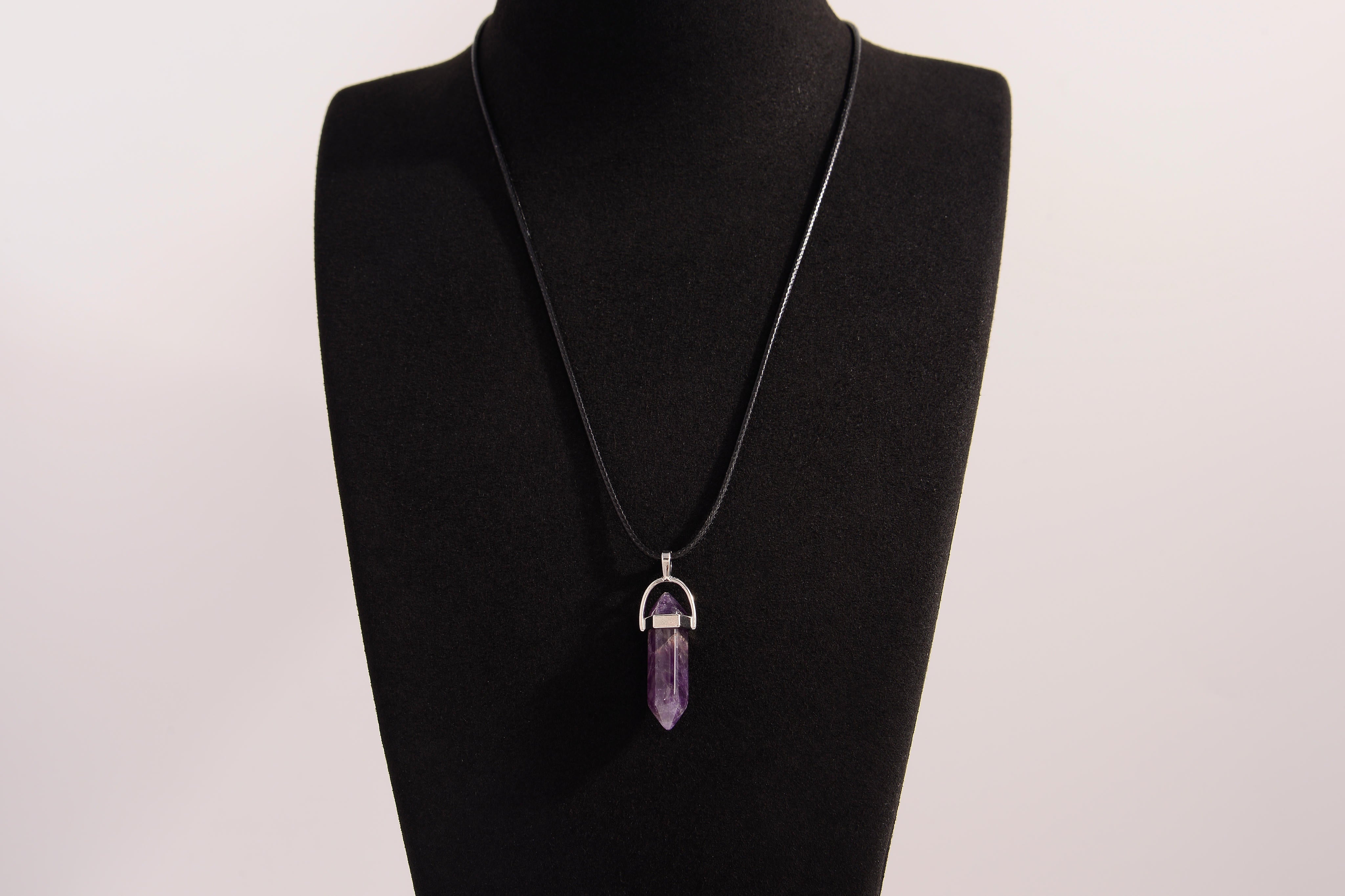 Raw Earth Crystals amethyst necklace with a pointed natural stone pendant, designed to enhance spiritual awareness, promote calmness, and support intuition.