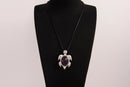 Raw Earth Crystals amethyst turtle necklace made from natural crystal to enhance spiritual awareness, calm the mind, and promote inner peace.