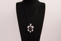 Raw Earth Crystals amethyst turtle necklace made from natural crystal to enhance spiritual awareness, calm the mind, and promote inner peace.