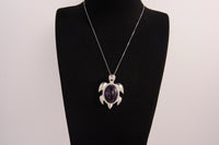 Raw Earth Crystals amethyst turtle necklace made from natural crystal to enhance spiritual awareness, calm the mind, and promote inner peace.