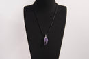Raw Earth Crystals amethyst pendant featuring an etched design, crafted from natural stone to enhance spiritual awareness, calm the mind, and support emotional balance.