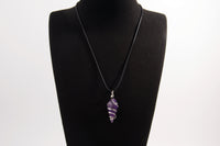Raw Earth Crystals amethyst pendant with a spiral wire wrap design, crafted from natural stone to support spiritual growth, intuition, and inner peace.