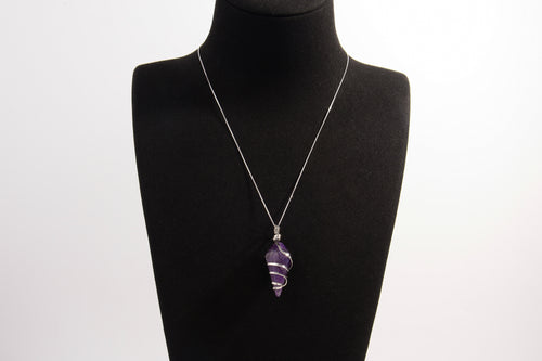 Raw Earth Crystals amethyst pendant with a spiral wire wrap design, crafted from natural stone to support spiritual growth, intuition, and inner peace.