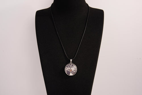 Raw Earth Crystals amethyst pendant featuring a tree of life design, crafted with natural crystal for spiritual awareness, calmness, and protection.