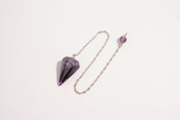 Raw Earth Crystals amethyst pendulum with pointed crystal and silver chain, crafted for intuition, spiritual growth, and inner peace.