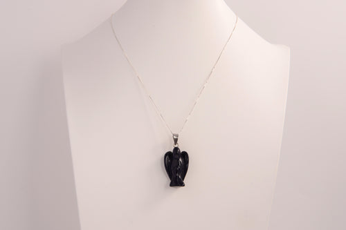 Raw Earth Crystals angel pendant crafted from blue sandstone, featuring a serene sculpted design to promote peace, protection, and spiritual connection.