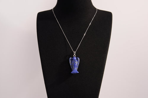 Raw Earth Crystals angel pendant crafted from carved lapis lazuli, featuring a deep blue hue with golden flecks to promote wisdom, intuition, and spiritual insight.