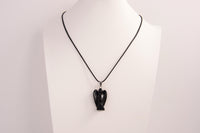 Raw Earth Crystals angel pendant crafted from carved obsidian, featuring a sleek, polished design to promote protection, grounding, and spiritual clarity.