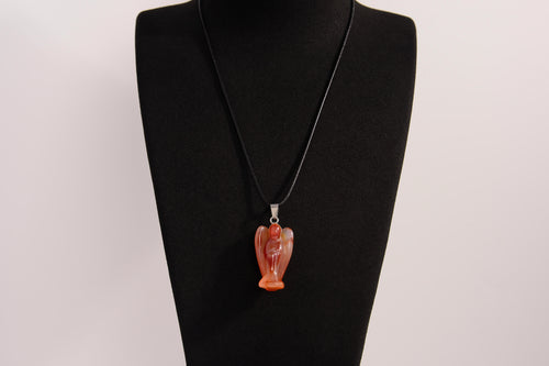 Raw Earth Crystals angel pendant crafted from carved red agate, featuring a warm, translucent design to promote courage, emotional strength, and grounding energy.