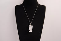 Raw Earth Crystals angel pendant crafted from clear quartz, featuring a delicate sculpted design to promote clarity, spiritual connection, and energetic purification.