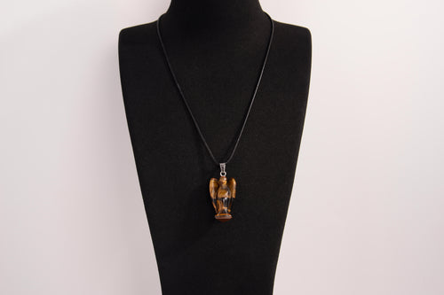 Raw Earth Crystals angel pendant crafted from tiger eye, featuring a polished sculpted design to promote confidence, protection, and grounding energy.