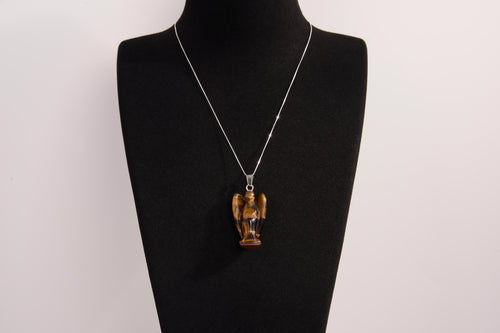 Raw Earth Crystals angel pendant crafted from tiger eye, featuring a polished sculpted design to promote confidence, protection, and grounding energy.