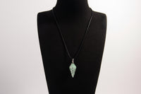 Raw Earth Crystals aventurine pendant with a spiral wire wrap design, crafted from natural stone to enhance luck, prosperity, and emotional balance.