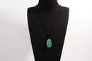 Raw Earth Crystals aventurine teardrop pendant on black cord, made from natural aventurine stone, promoting luck, prosperity, and emotional balance.