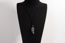Raw Earth Crystals black labradorite point pendant necklace featuring natural crystal jewelry designed for intuition, spiritual insight, and inner strength.