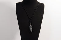 Raw Earth Crystals black labradorite point pendant necklace featuring natural crystal jewelry designed for intuition, spiritual insight, and inner strength.