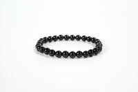 Black obsidian beaded bracelet from Raw Earth Crystals, featuring natural gemstones for protection, grounding, and spiritual clarity.