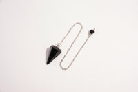 Raw Earth Crystals black obsidian cone pendulum on silver chain, crafted from natural black obsidian stone, promoting protection, grounding, and spiritual clarity.