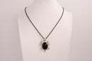 Raw Earth Crystals black obsidian turtle necklace made from natural crystal to offer grounding, protection, and emotional stability.