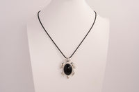 Raw Earth Crystals black obsidian turtle necklace made from natural crystal to offer grounding, protection, and emotional stability.