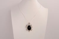 Raw Earth Crystals black obsidian turtle necklace made from natural crystal to offer grounding, protection, and emotional stability.