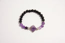 Raw Earth Crystals black onyx and amethyst bracelet with silver accent, crafted from natural crystals, promotes spiritual awareness, calmness, and emotional balance.