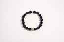 Raw Earth Crystals black onyx and blue goldstone faceted bracelet with silver accent, crafted from natural crystals, promotes protection, confidence, and inner strength.